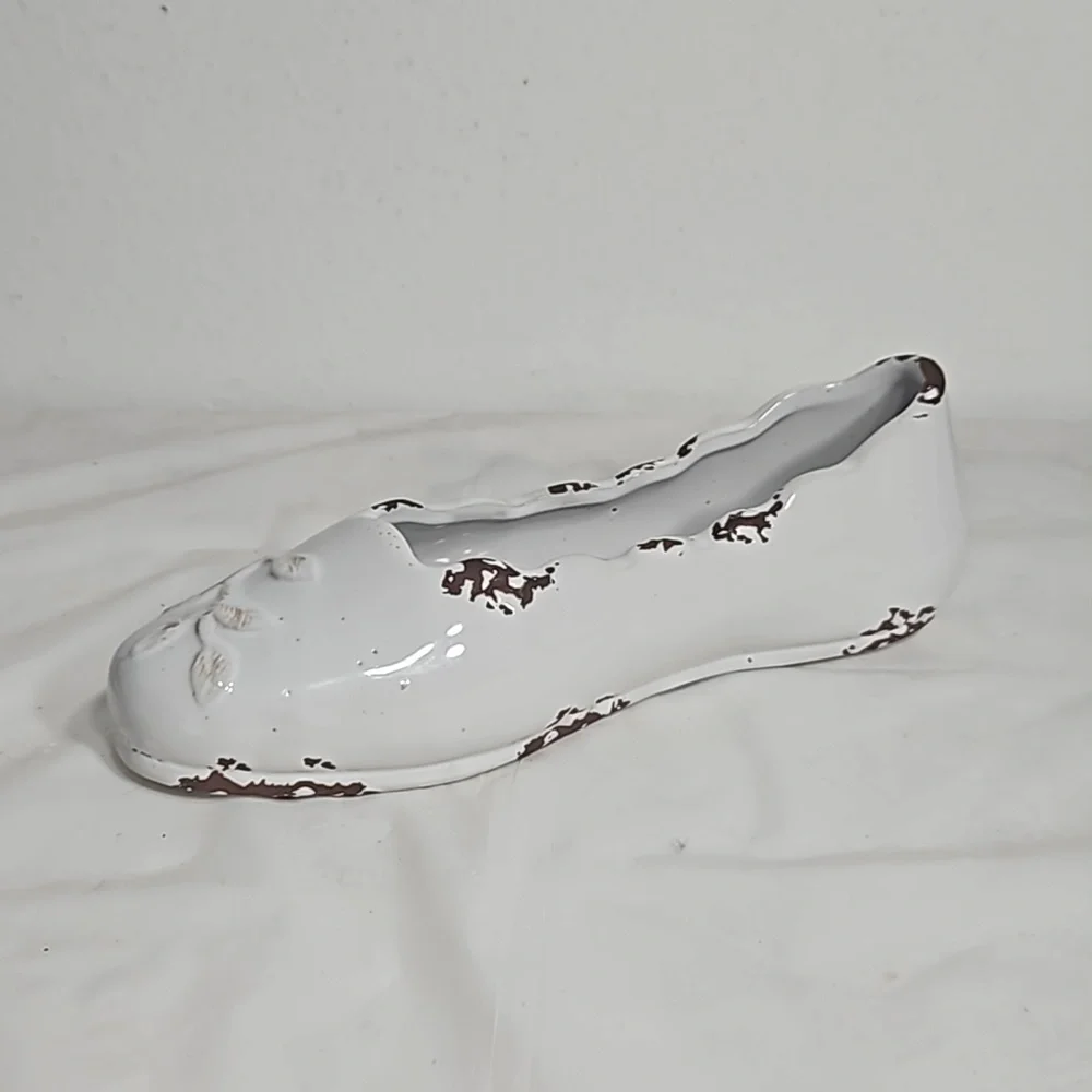 Decorative ceramic ballet shoe vase with vine design